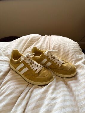 Yellow and white striped sneakers